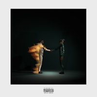 a man and a woman shaking hands in the dark